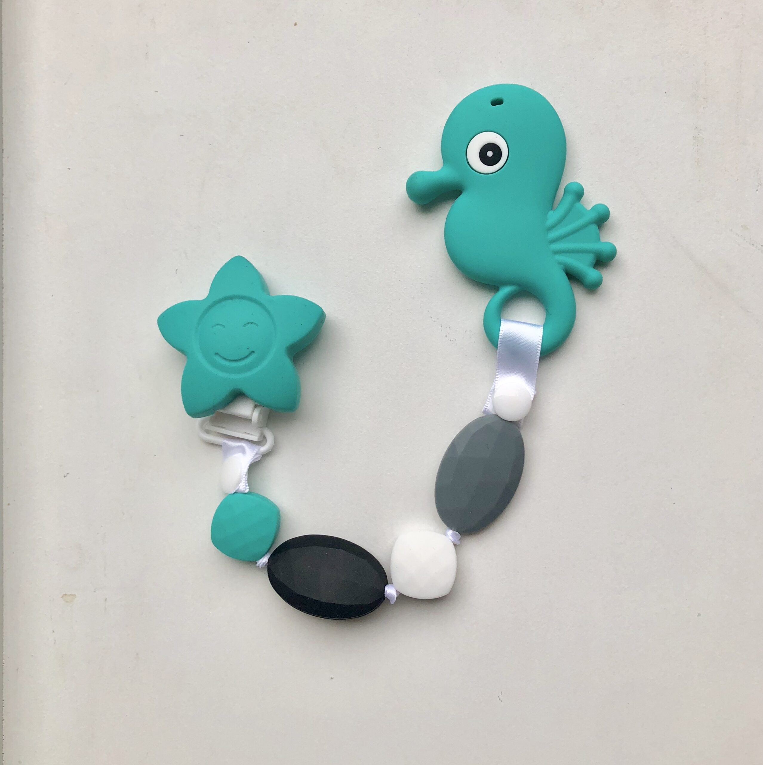 teal seahorse teething clip made from silicone